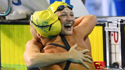 Cate Campbell celebrates her win with Holly Barratt. (Getty)