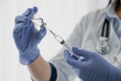 Nurse holding a needle. Injection. Vaccine.