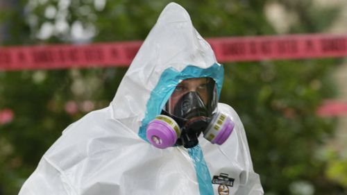 Shares in hazmat gear manufacturers have soared on the back of Ebola fears. (AAP)