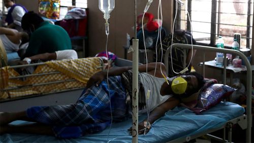 A patient at a hospital in India lies in bed suffering from mucormycosis, or black fungus.