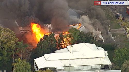 The house is well alight. (9NEWS)