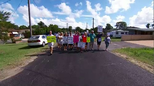 Residents of Woy Woy are angry after receiving fines for parking on the grass - as some have done for years.