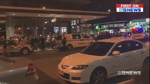 The chaos spilled onto the street outside the Triffid last night. (9NEWS)