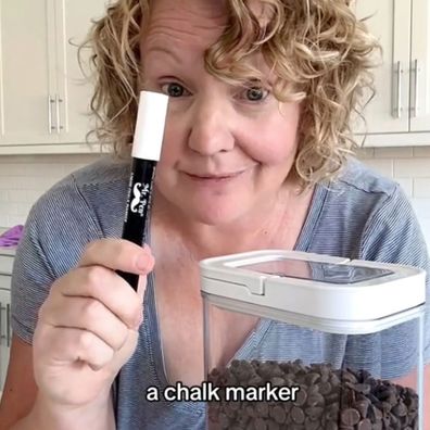 Carole Jones demonstrates her chalk marker pantry labelling hack.