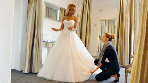 Would-be newlywed Zoe tests out her gown. (Nine Network)