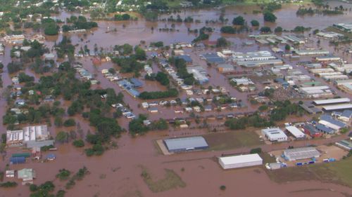 Aerial images obtained by 9News show buildings in Lismore surrounded by floodwaters. 