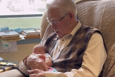 Wilf Driscoll meeting his great-granddaughter Millie for the first time.