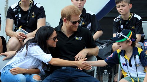 Markle greets a young Invictus Games fan. (AAP)