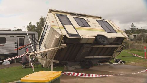 Family trapped in a caravan after a gust of wind tips it over at Moana Beach Tourist Park in Adelaide