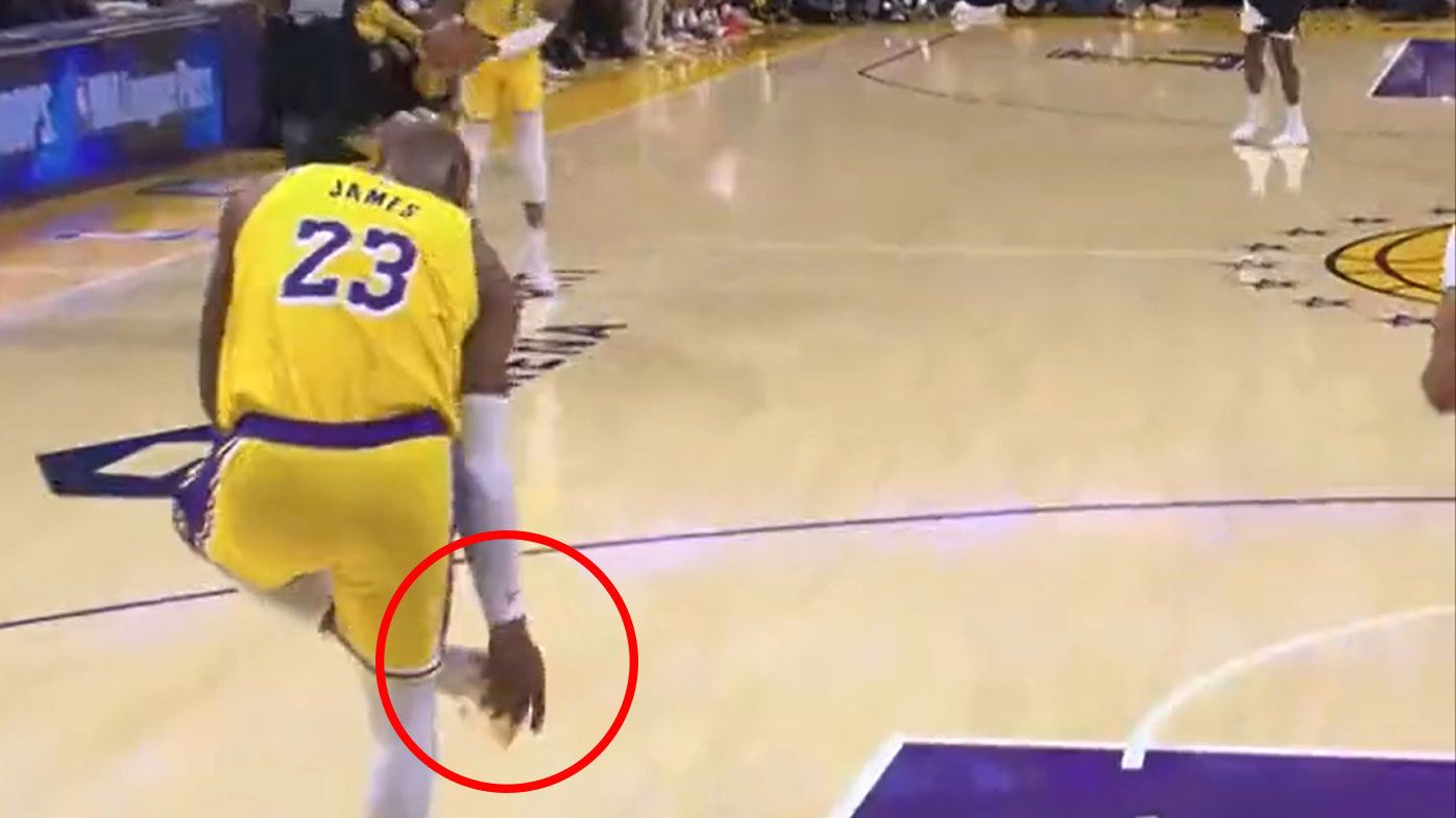 LeBron James lagged behind the play to adjust his sneakers before finishing the possession with a thunderous dunk