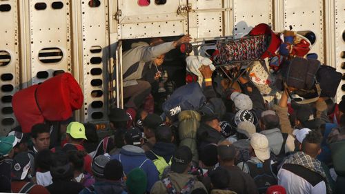 Asylum seekers pack into a chicken truck to escape the violence in Latin America.