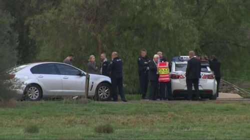 Police at the scene of the triple murders. (9NEWS)