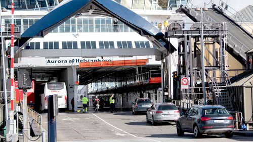 Police operations are seen at the closed ferry port in Helsingoer, Denmark.