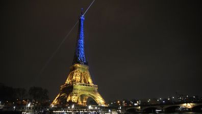 The Eiffel Tower is illuminated with the colors of Ukraine to mark the one-year anniversary of Russia&#x27;s invasion of the country, in Paris, Thursday, Jan. 23, 2023.