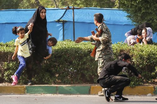 The attack, in which militants disguised as soldiers opened fire on an annual Iranian military parade in Ahvaz, was the deadliest attack in the country in nearly a decade. (AAP)