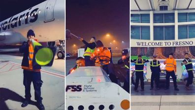 Airport workers performing on the tarmac