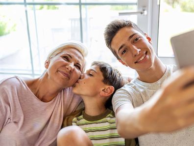 Mum and two sons taking a selfie