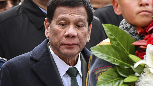 Philippine President Rodrigo Duterte attends a wreath laying ceremony at the Tomb of the Unknown Soldier in Moscow, Russia, Friday, Oct. 4, 2019. (Yury Kadobnov/Pool Photo via AP)