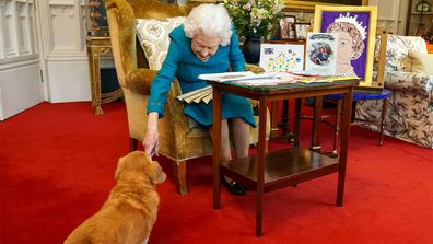 The queen and one of her corgis.