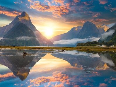 Famous Mitre Peak rising from the Milford Sound fiord. Fiordland national park, New Zealand.