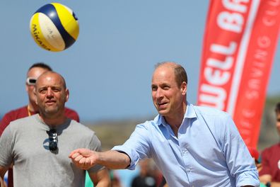 Prince William, the Duke of Cornwall plays volleyball, as he visits Fistral Beach on May 9, 2024 in Newquay, Cornwall, England.