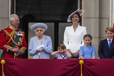Prince Charles, from left, Queen Elizabeth II, Prince Louis, Kate, Duchess of Cambridge, Princess Charlotte, and Prince George on the balcony of Buckingham Palace, London, Thursday June 2, 2022, on the first of four days of celebrations to mark the Platinum Jubilee. The events over a long holiday weekend in the U.K. are meant to celebrate the monarch's 70 years of service.