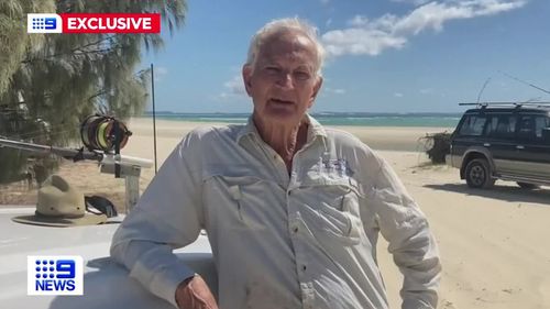 A retiree has been forced to wade into the water to dodge a pack of dingoes on the Queensland island of K'gari, formerly known as Fraser Island.Fisherman David Prain, 74, was forced into waist-deep water amid a stand-off with four of the animals.