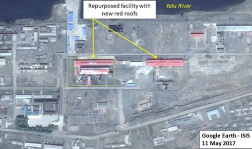 A North Korean site captured in a satellite image shows a red-roofed building which could be used to produce materials for nuclear reactors - contradicting North Korea's promise. (Google Earth)