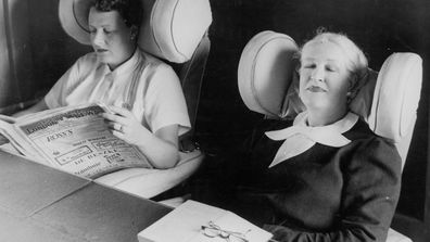 Passengers enjoying a relaxing moment on board their Qantas Empire Flying Boat flight.