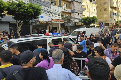 Ambulances arrive at the scene of an Israeli missile strike in the southern suburbs of Beirut, Friday, Sept. 20, 2024. 