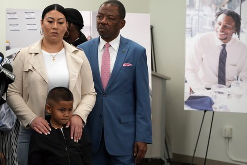 Lawyer Carl Douglas, right, holds a news conference with Gabrielle Hansel, guardian of five-year-old Syncere Kai Anderson, to announce filing a $50 million in damages claim against the city of Los Angeles over the death of Keenan Anderson, seen photo right.