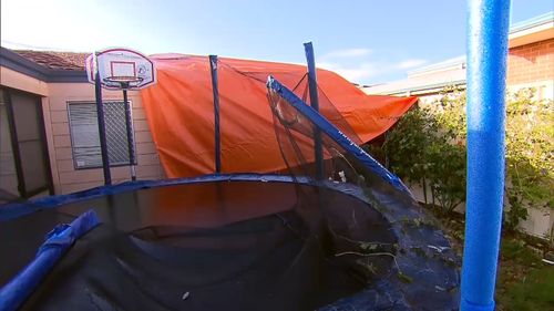 Parts of the patio ended up on a neighbour's carport and trampoline. Picture: 9NEWS