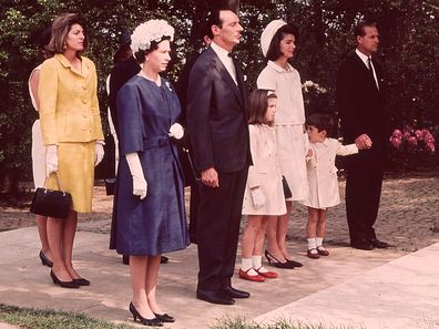 Queen Elizabeth II and Prince Philip with Jackie Kennedy and her children John Jr and Caroline during the inauguration of Britain's Kennedy memorial at Runnymede in 1965.