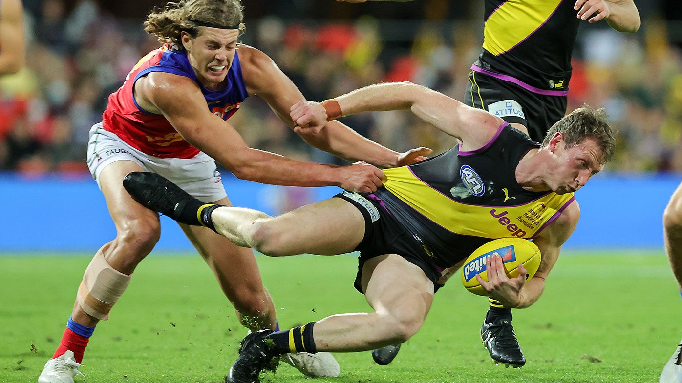 'Lost the plot': Farcical scenes as AFL umpires cause confusion with 'dangerous tackle' calls