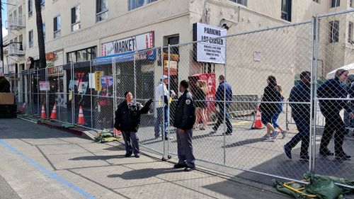 Security guards man an enclosure entry point. (9NEWS/Ehsan Knopf)