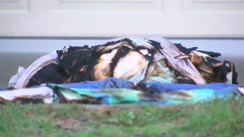A burned doona doused in a flammable liquid is currently the focus of investigations. (9NEWS)
