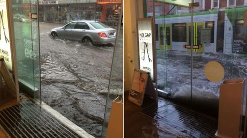 Water splashes against the front windows of the Specsavers store in Burke Road, Camberwell. (@ptingate)