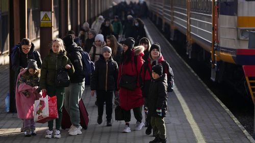 People fleeing the conflict from neighbouring Ukraine arrive to Przemysl train station in Przemysl, Poland.