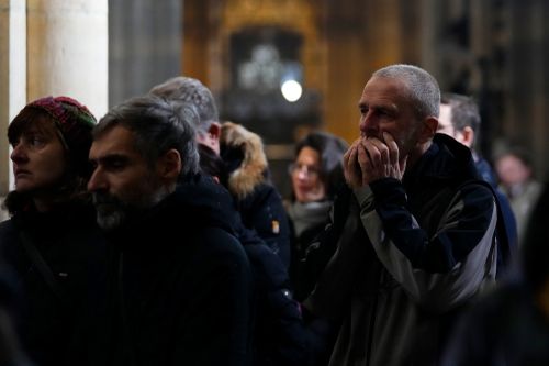 Mourners attend memorial service for the victims of Philosophical Faculty of Charles University shooting in the St. Vitus Cathedral in Prague, Czech Republic, Saturday, Dec. 23, 2023. 