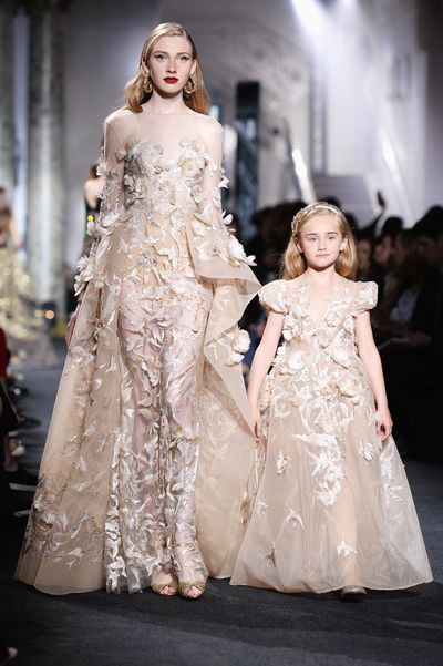 Elie Saab's ornate haute couture wedding gown is always a show-stopping moment, but this season  the runway bride was almost overshadowed by an army of mini-mes in matching couture gowns. Seven models walked the runway with a pint-sized companion in a children's version of the original dress. Click through to see all the adorable pairings.&nbsp;
