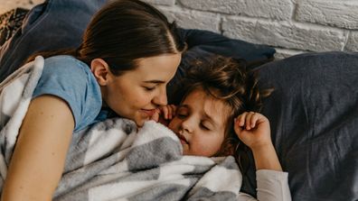 Mother and boy sleeping