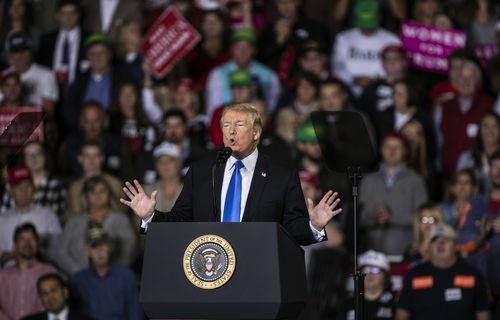 Trump speaks to cheers from his supporters in Richmond at Eastern Kentucky University, at the weekend.