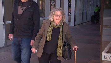 Lynette Dawson&#x27;s friend Roslyn McLoughlin leaves court after taking the stand at Chris Dawson trial.