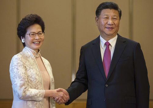 Chinese President Xi Jinping poses with Carrie Lam ahead of a meeting in Hong Kong, in 2017.