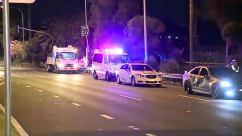 The driver of the Holden Commodore was treated for shock at the scene. (9NEWS)