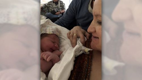 Ms Patten and Theo were taken to hospital after the unexpected driveway birth. (9NEWS)