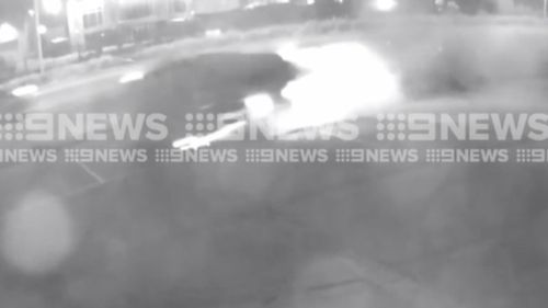 Sparks were seen flying as the BMW dragged the parked car metres down the road. (9NEWS)