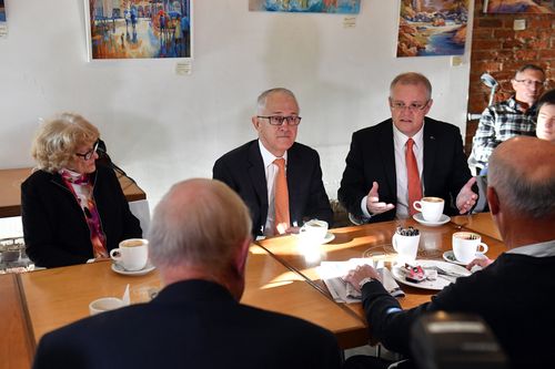 Malcolm Turnbull and Treasurer Scott Morrison speak to senior citizens at a coffee shop in Queanbeyan today. Picture: AAP