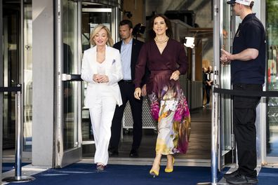 Denmark's Queen Mary, centre right, and Director of Global Fashion Agenda, Federica Marchionni, walk at the Global Fashion Summit: Copenhagen Edition at the DR Concert Hall in Copenhagen, Wednesday, May 22, 2024. (Ida Marie Odgaard/Ritzau Scanpix via AP)