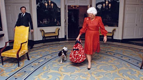 Barbara Bush in the White House with her dog Millie in 1989. (AAP)